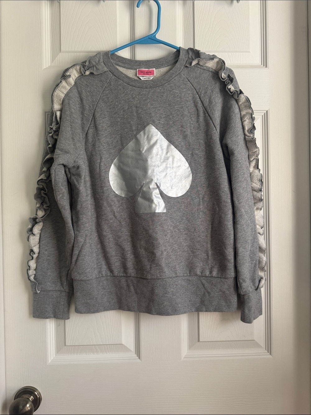 kate spade gray sweatshirt with silver spade and ruffle sleeves